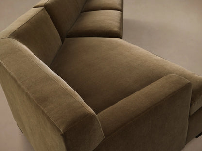Front view of the olive green Bronte Two-Piece Cuddle Chaise Sectional, an L-shaped sofa with soft velvety upholstery.