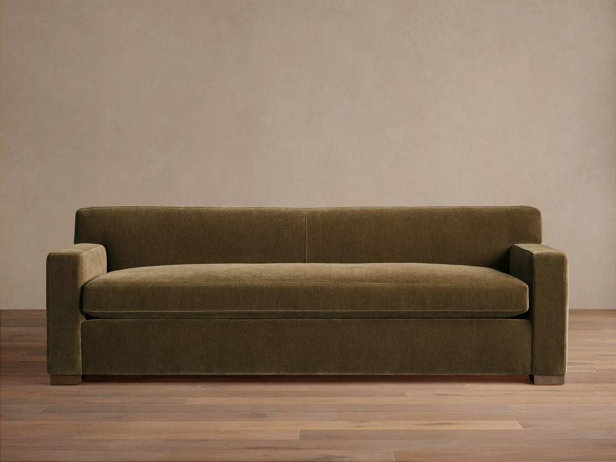 Front view of the olive green Bronte Bench-Seat Sofa with a single bench cushion and wide square arms.