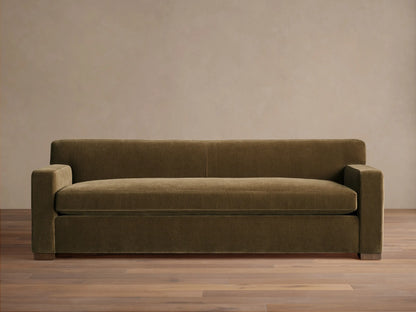 Front view of the olive green Bronte Bench-Seat Sofa with a single bench cushion and wide square arms.