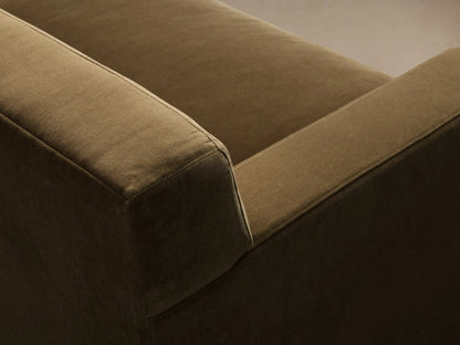 Close-up of the olive green Bronte Bench-Seat Sofa, showing the textured fabric on the armrest and seat cushion.