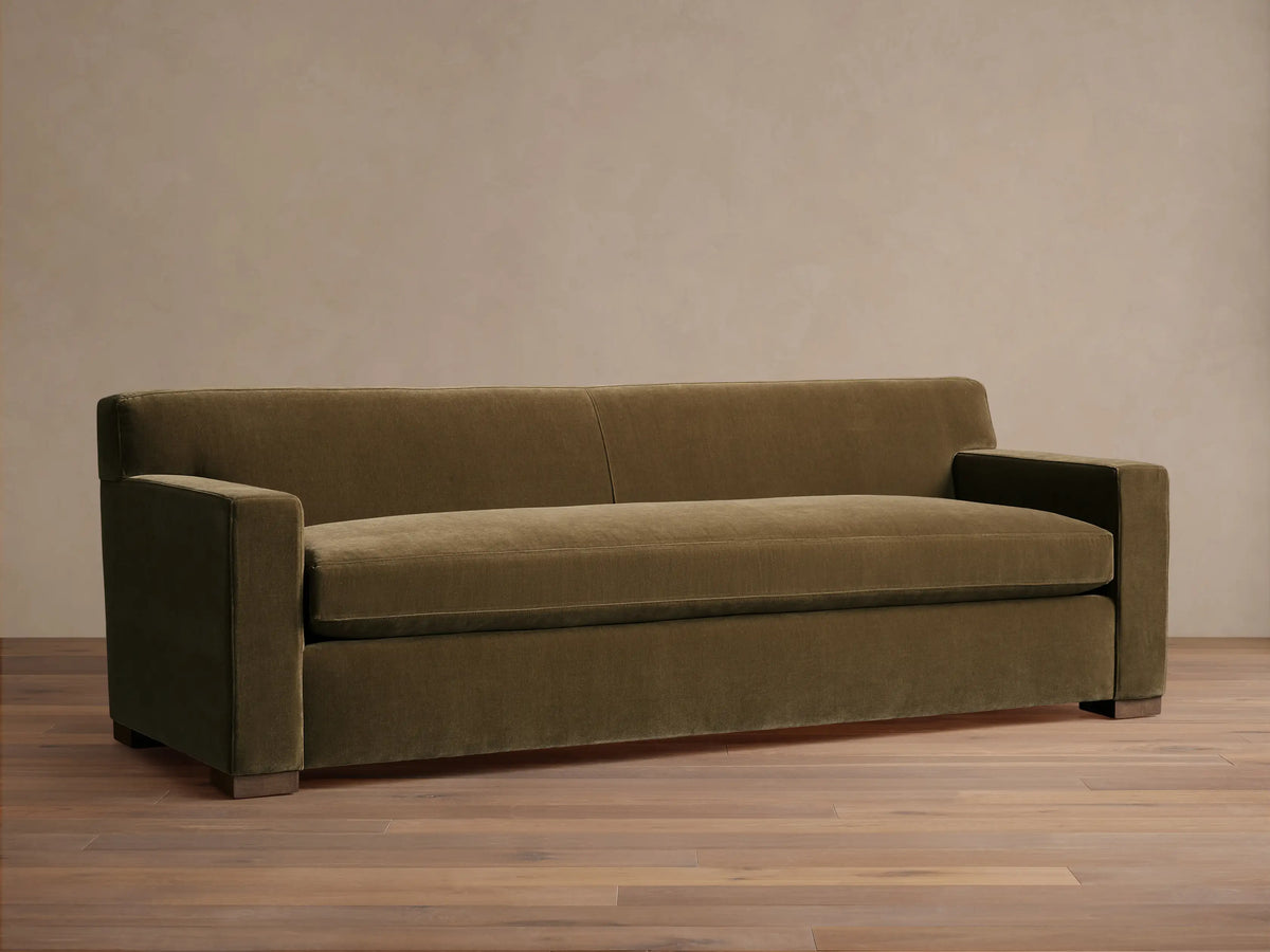 Front view of the olive green Bronte Bench-Seat Sofa with a single bench cushion and wide square arms.