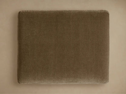 Close-up of the Bronte Ottoman cushion in a rich moss green, showcasing its plush, soft textured fabric and detailed stitching.