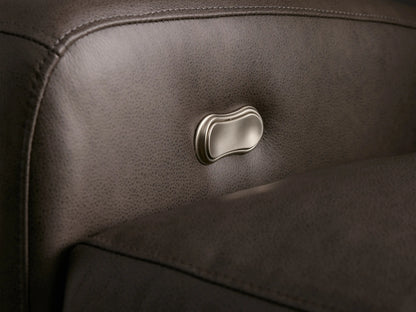 Close-up, high-angle of the dark grey pebbled Colfax Leather Motion Recliner, partially reclined with elevated footrest.