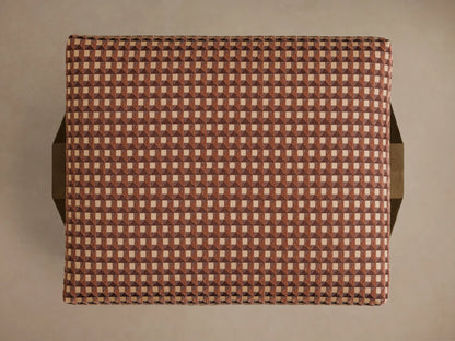 Overhead view of the Elias Ottoman, upholstered in a brown and beige isometric tile pattern of small squares.