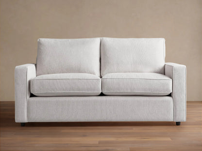 Filmore Air Sleeper Sofa: light gray two-seat sofa with square arms, textured fabric, on a wood floor.