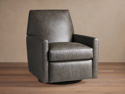 Harvey Leather Swivel Recliner in textured charcoal grey leather, front-right view, on a wooden floor against a beige wall.