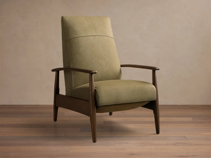 Front view of a sage green upholstered armchair with a horizontal back seam, dark wood armrests, and tapered legs.