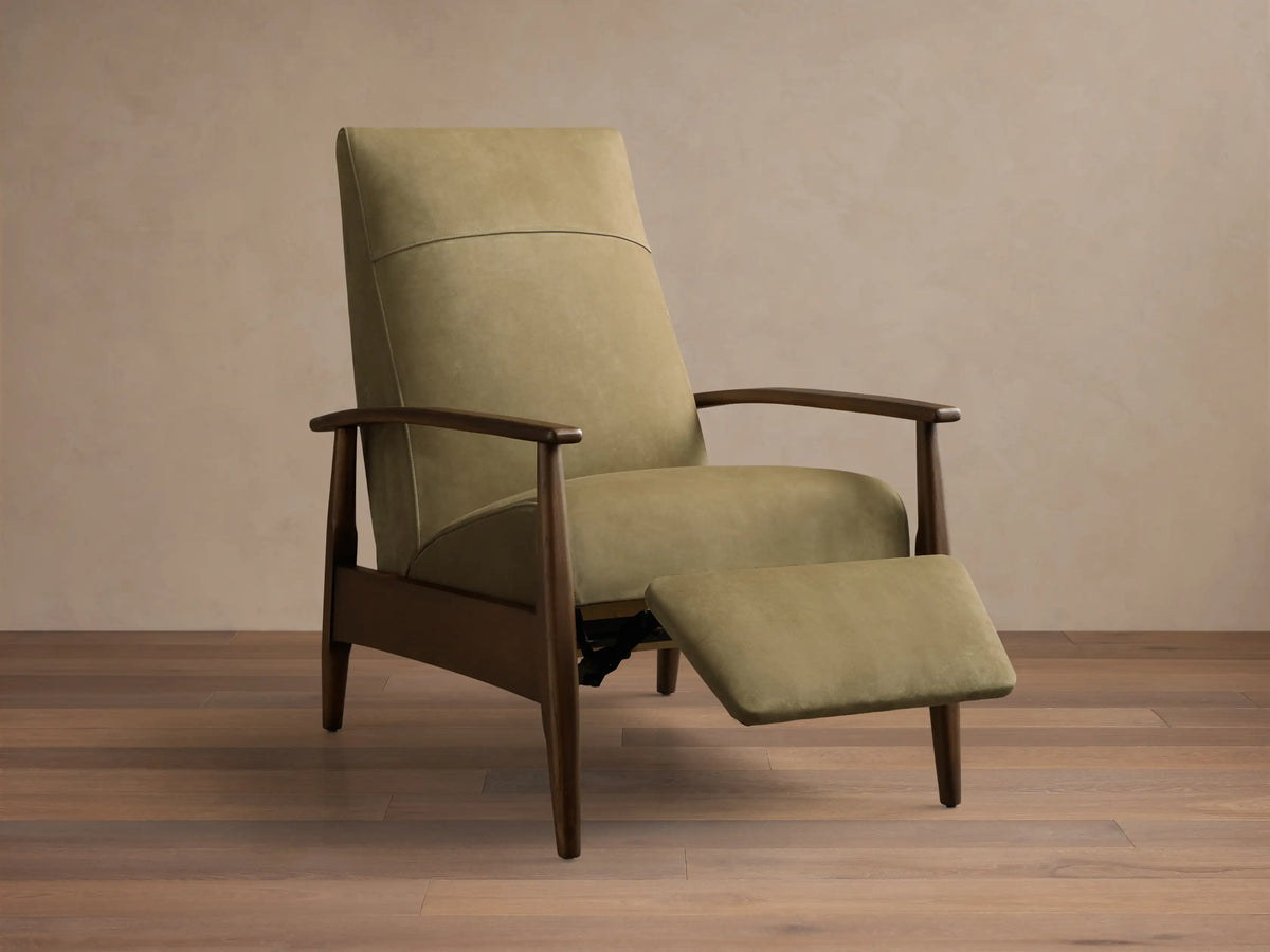 Front-side view of an olive green upholstered Recliner Chair with dark wooden armrests and tapered legs, footrest extended.