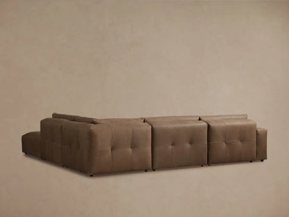 Keegan Leather Five-Piece Sectional in rich brown leather with smooth texture, featuring plush seat and backrest with subtle tufting.