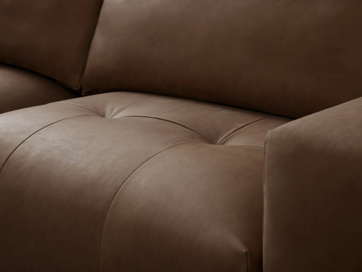 A brown leather Keegan Five-Piece Sectional with wide, cushioned seats and backrests, arranged in an L-shape on a wooden floor.