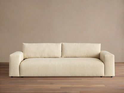 Keegan Tailored Sofa, light beige textured fabric. Modern style, two back cushions, wide square arms, on a wooden floor.