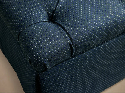 Front view of the dark blue pin dot Liddie Square Ottoman with a tufted top and pleated skirt.