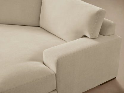 Norwalk Two-Piece Cuddle Chaise Sectional in neutral beige fabric, featuring plush cushions and a right-facing chaise on wooden flooring.