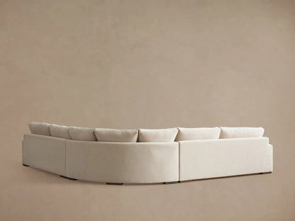 Norwalk Three-Piece Corner Wedge Sectional in beige fabric, showcasing plush cushions and wide armrest on a beige background.