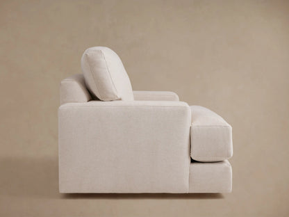 Norwalk Swivel Chair in neutral fabric, showcasing plush seat and back cushions, with visible armrests and beige upholstery.
