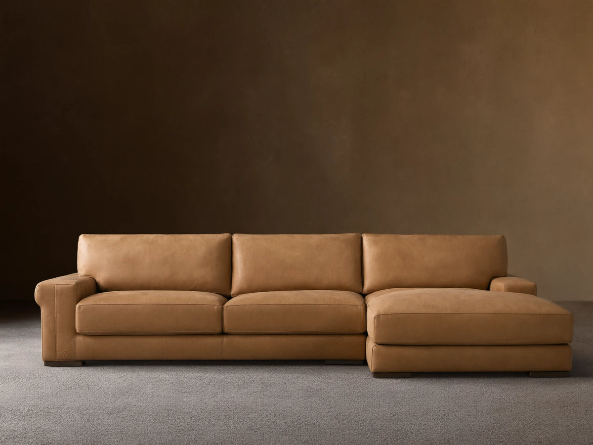 Norwalk Leather Two-Piece Chaise Sectional in tan leather; chaise on left, three back cushions, sleek and contemporary design on wooden floor.