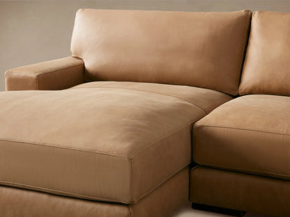 Norwalk Leather Two-Piece Chaise Sectional in tan leather, featuring left-facing chaise. Plush cushions and sleek design on wood floor.