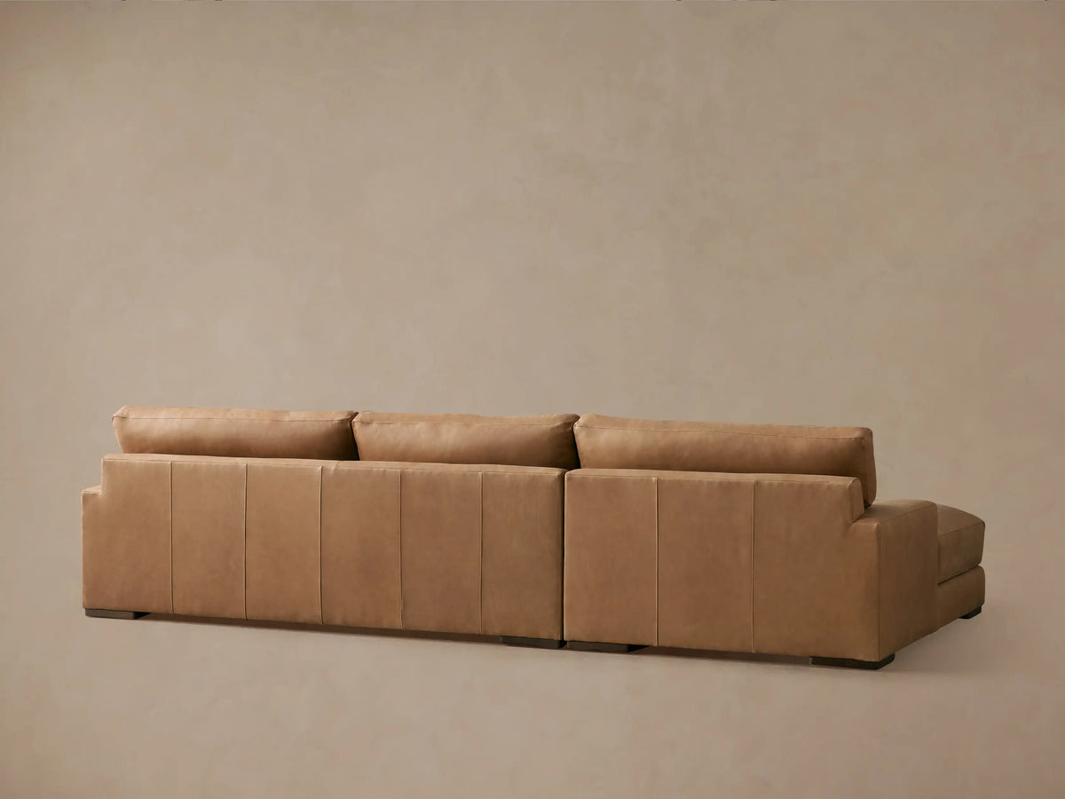 Norwalk Leather Two-Piece Chaise Sectional in tan leather, features plush cushions, square armrest, and seamless stitching.