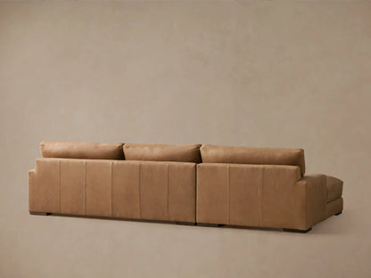 Norwalk Leather Two-Piece Chaise Sectional in tan leather, features plush cushions, square armrest, and seamless stitching.