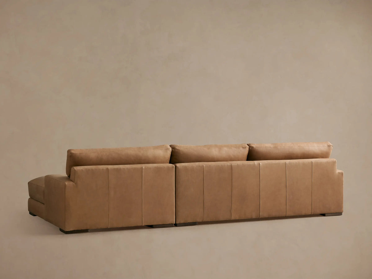 Norwalk Leather Two-Piece Chaise Sectional in a light tan leather, featuring plush cushions and an extended chaise for relaxation.