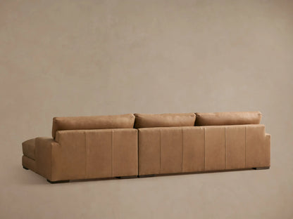 Norwalk Leather Two-Piece Chaise Sectional in a light tan leather, featuring plush cushions and an extended chaise for relaxation.
