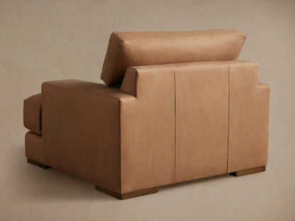 Brown Norwalk Leather Chair with close-up of armrest and seat. Smooth, richly colored leather with fine stitching detail.