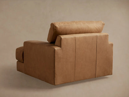 Norwalk Leather Swivel Chair in a warm brown hue, featuring plush, smooth leather upholstery, wide armrests, and a deep seat.