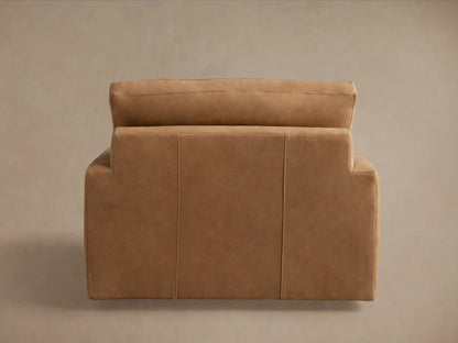 Norwalk Leather Swivel Chair in tan leather, featuring a plush backrest and seat cushions, with a boxy, modern design.