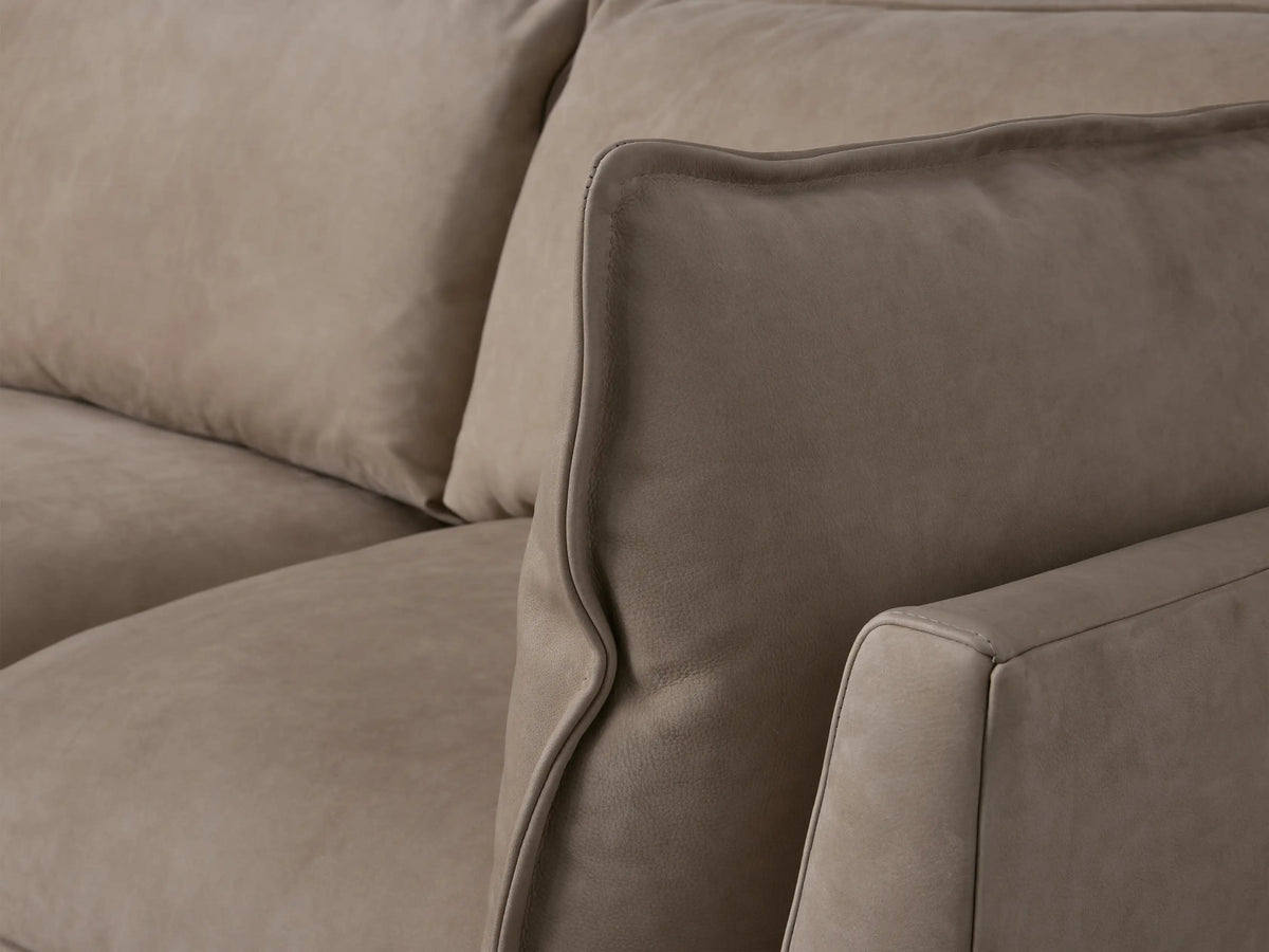 Owen Nubuck Leather Five-Piece Sectional, light gray L-shaped sofa with deep cushions & left chaise, on wood floor.