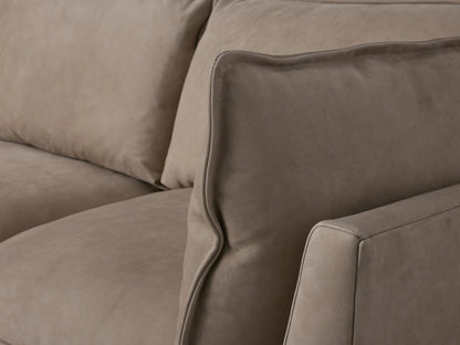 Owen Nubuck Leather Five-Piece Sectional, light gray L-shaped sofa with deep cushions & left chaise, on wood floor.