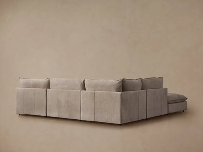Owen Nubuck Leather sectional, light taupe, close-up of armrest, seat, and back cushion, highlighting soft, velvet-like texture.