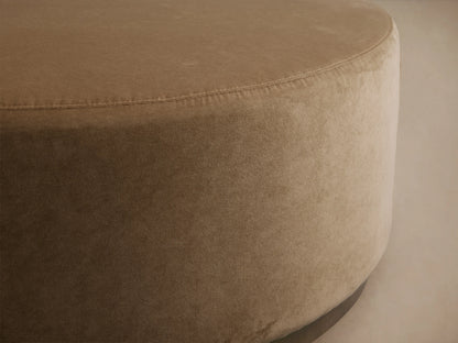 Ryles Plinth Ottoman in beige fabric, close-up of round edge and smooth texture on a subtle background.
