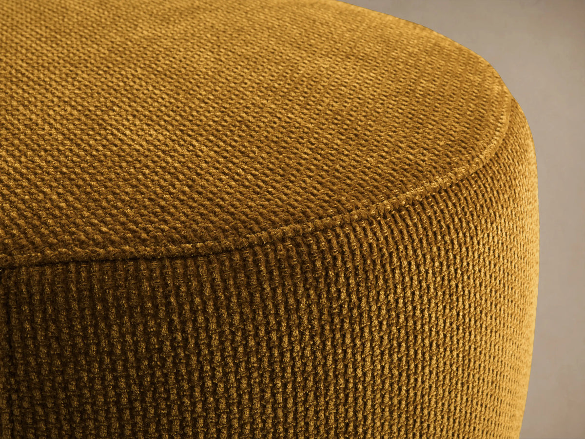 Close-up of the mustard yellow ribbed fabric on the Ryles Plinth Ottoman.