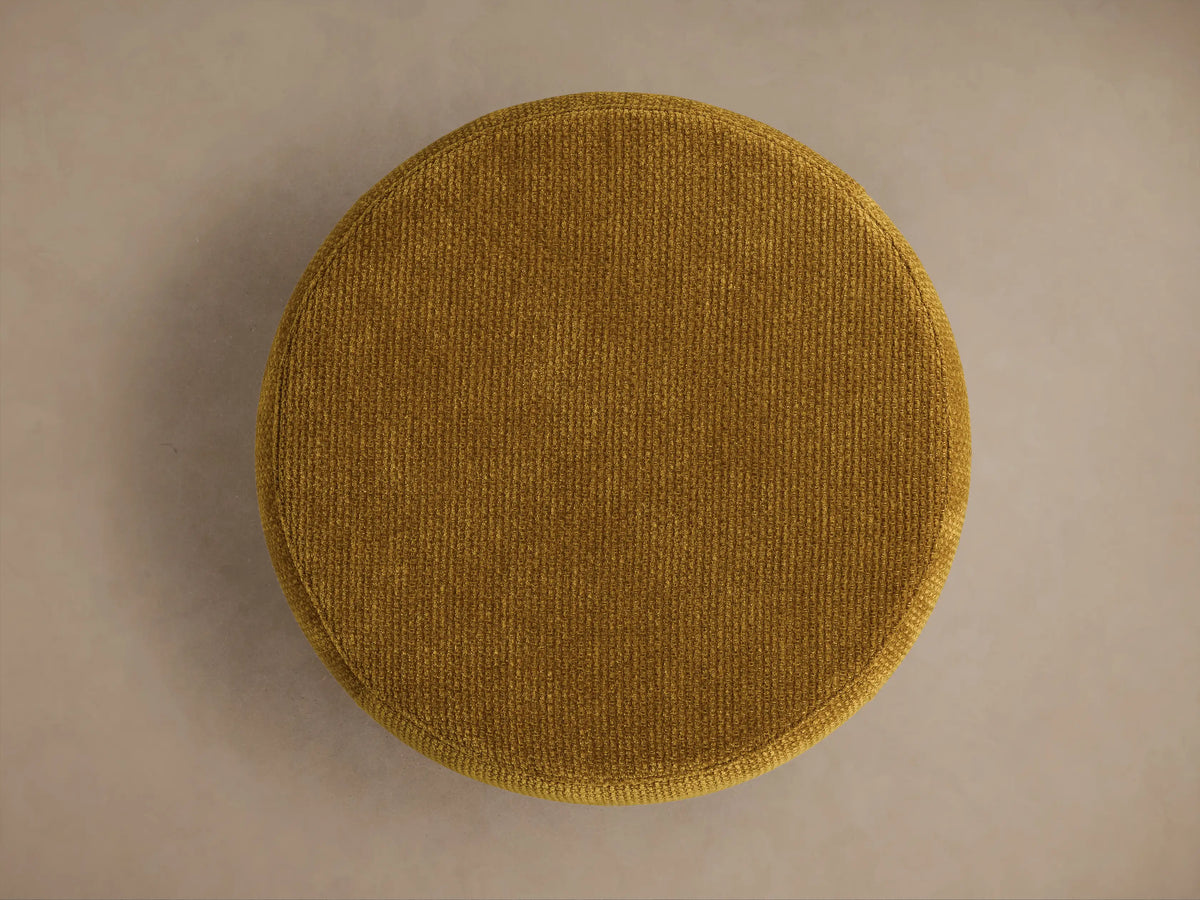 Top-down view of the round mustard yellow Ryles Plinth Ottoman, featuring a fine ribbed texture.