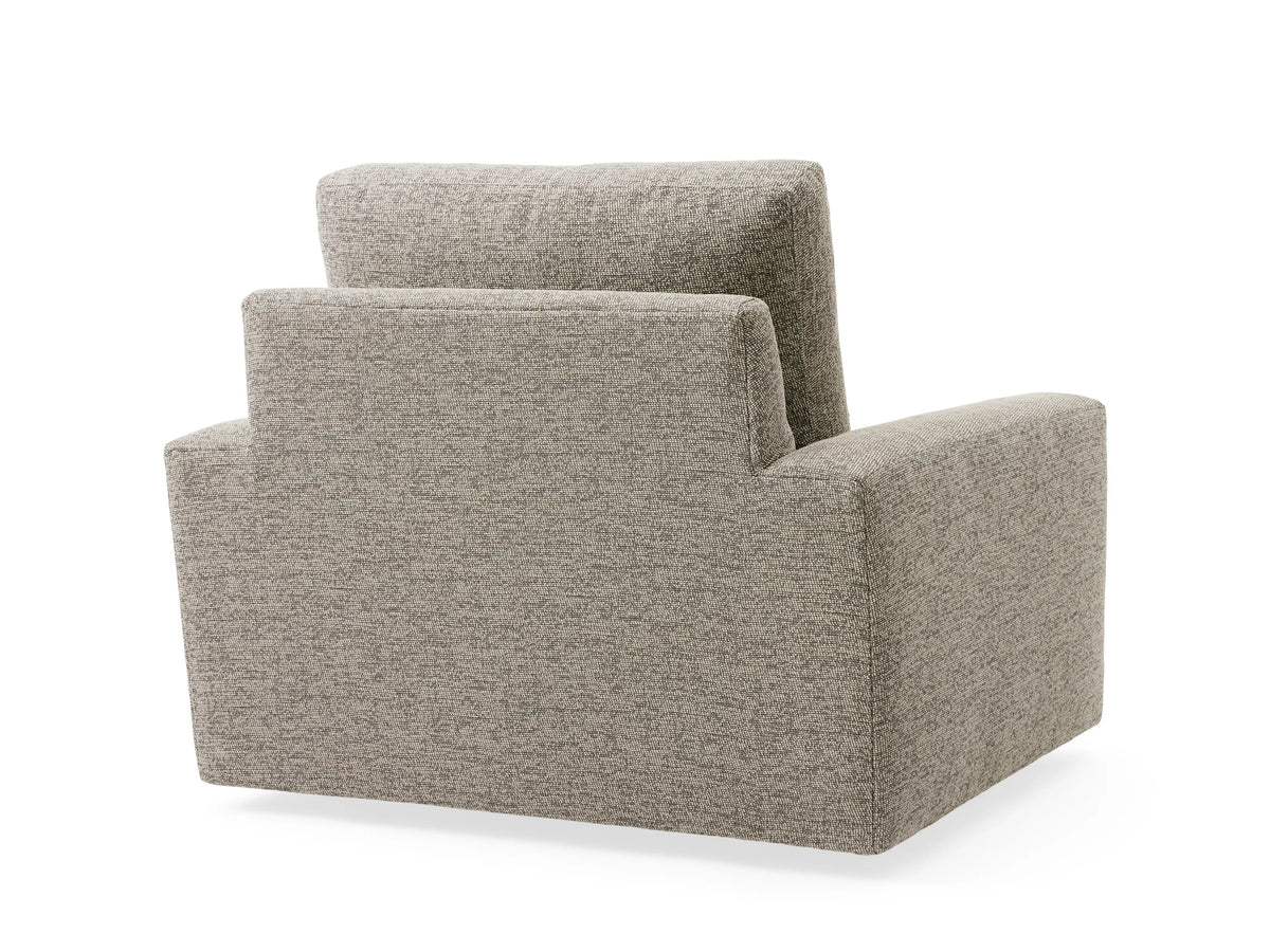 Front view of Remington Outdoor Swivel Chair with gray textured fabric, featuring thick cushioned seat, back, and armrests, set against a coastal backdrop.