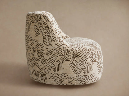 Sonny Swivel Chair: curved back, light beige fabric with an intricate dark brown organic pattern, seen from behind at an angle.