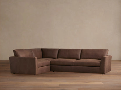 Brown Vernon Leather Two-Piece Sectional, L-shaped, on light wood floor, features plush cushions and a smooth finish.