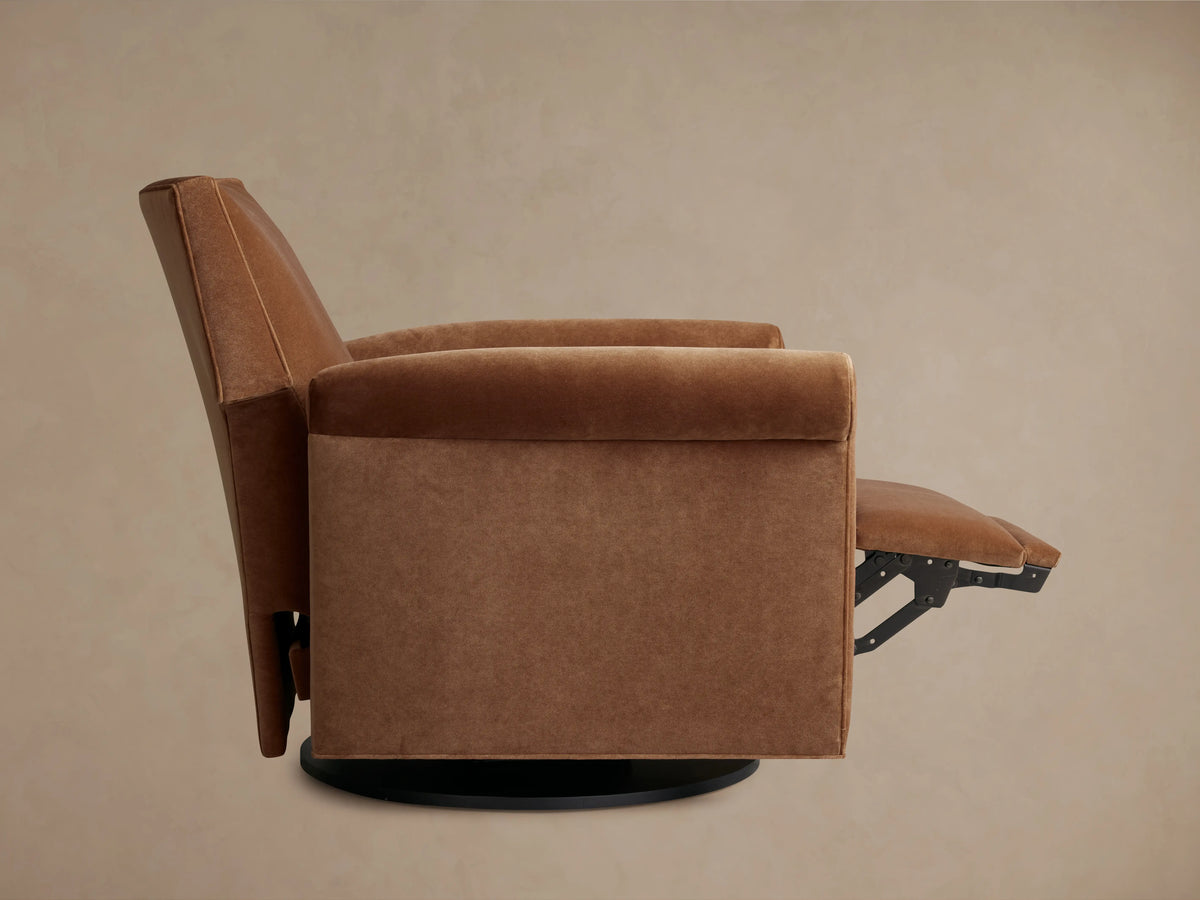 Beige Rudy Rolled Arm Swivel Recliner close-up showing plush velvet fabric, rolled arm design, and extended footrest.