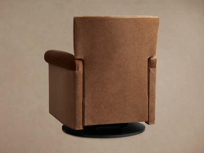 Rudy Rolled Arm Swivel Recliner in cognac velvet, side view. Reclined position showing cushioned seat, rolled arms, and swivel base.