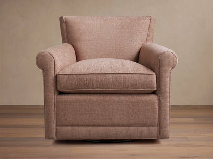 Rudy Rolled Arm Swivel Chair in light brown fabric, featuring rolled arms and a plush cushion on a wooden floor background.
