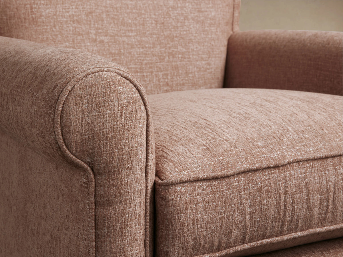 Rudy Rolled Arm Swivel Chair in a warm brown velvet fabric, featuring rolled arms, a plush seat cushion, and a 360-degree swivel base.