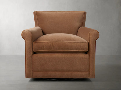Rudy Rolled Arm Swivel Chair in Banks Cognac, featuring rolled arms, plush seat cushion, and 360-degree swivel on a neutral background.