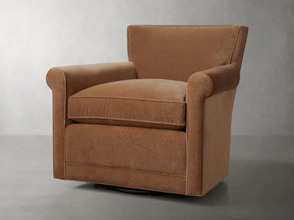 Rudy Rolled Arm Swivel Chair in Banks Cognac, featuring rolled arms, plush seat cushion, and 360-degree swivel on a neutral background.