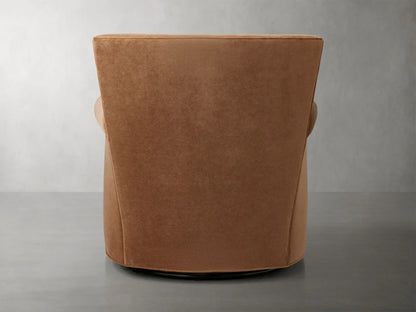 Rolled arm of Rudy Swivel Chair in Banks Cognac velvet, showcasing smooth texture and rich brown color.