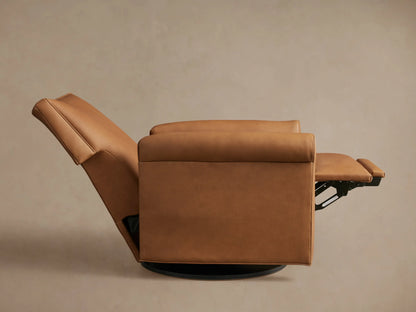 Camel leather Rudy Rolled Arm Swivel Recliner, side view, with sleek rolled arms and black circular swivel base.
