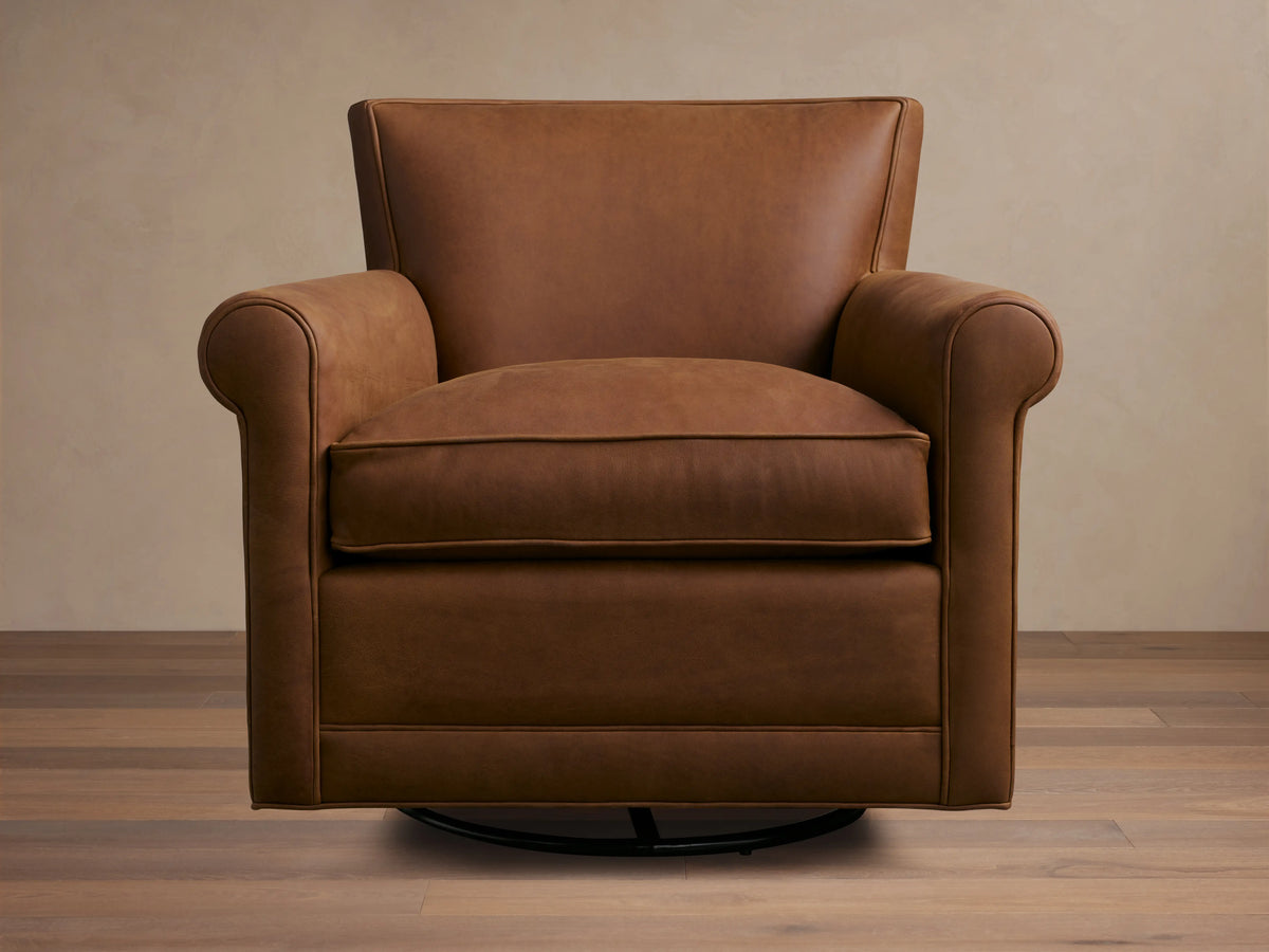 Rudy Leather Rolled Arm Swivel Chair in rich brown leather with rolled arms, plush seat cushion, and a sturdy swivel base.