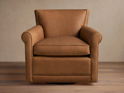 Warm tan leather Rudy Rolled Arm Swivel Chair, featuring rolled arms, a plump seat cushion, and a discreet black swivel base.
