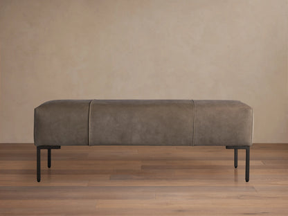 Tilton Nubuck Leather Bench with dark, velvet-like nubuck leather upholstery on a sleek design. Supported by thin golden legs.