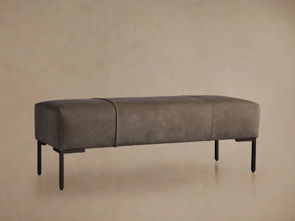 Tilton Nubuck Leather Bench with a dark, velvet-textured surface, resting on light wooden legs against a neutral background.