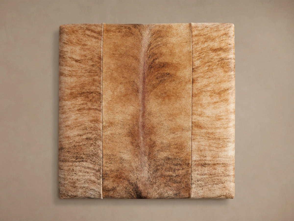Rectangular Tilton Hair on Hide Ottoman, blonde brindle with patchwork seams, on slender gold metal legs.